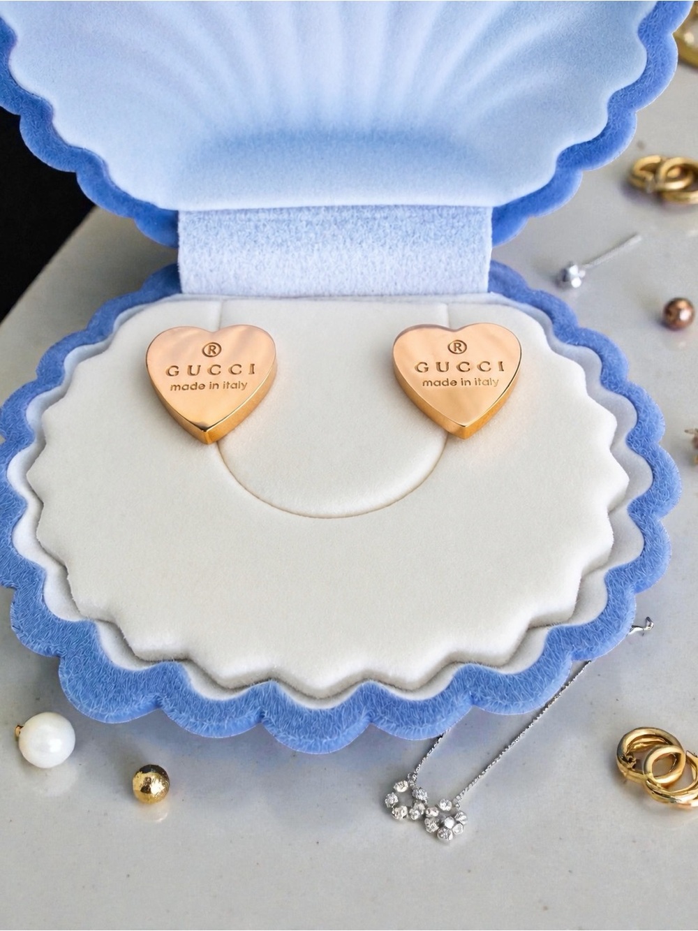 Rose gold in color, lightweight, simple but gorgeous UNAUTHENTIC stud earrings.